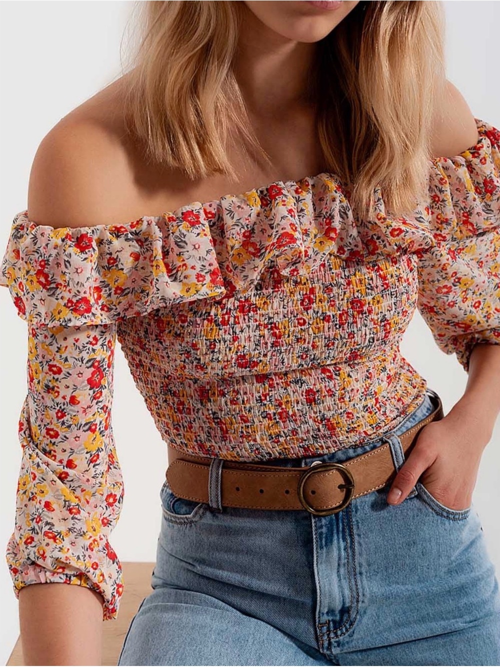 Shirred off the shoulder top with ruffle in coral floral print